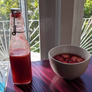 Finished syrup along side macerating strawberries